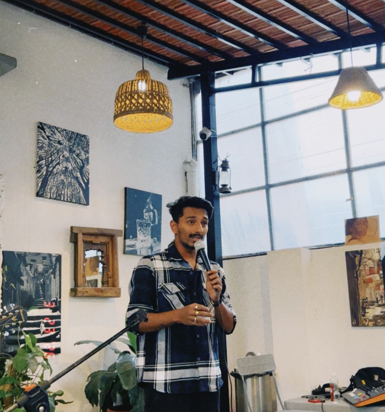 A speaker addressing the room with a microphone