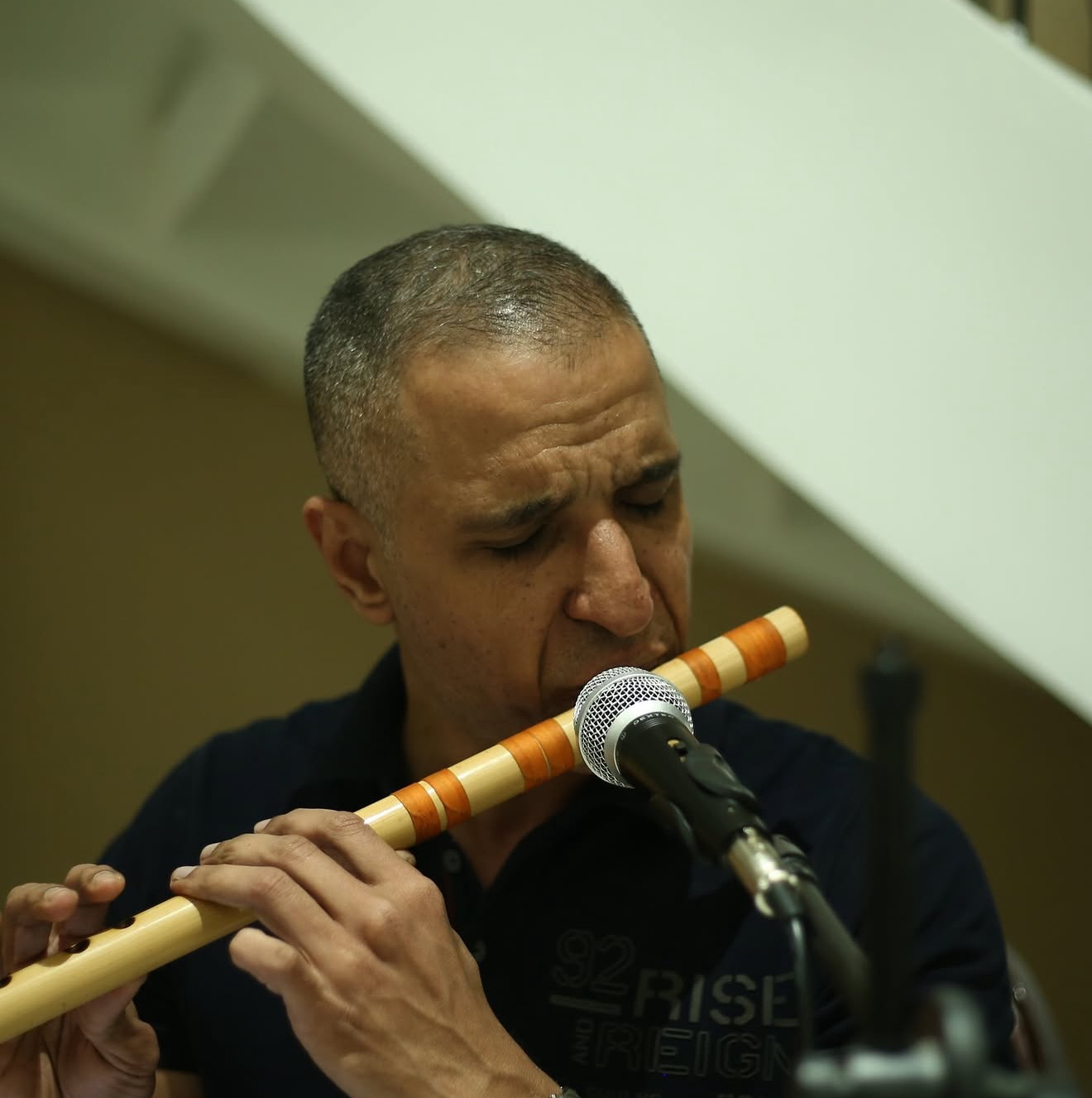 A musician playing a bansuri flute